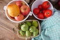 Vegetables and fruits at a wooden table. Tomatoes, apples and Pears