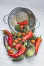 Vegetables laid out by a colander