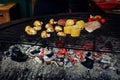 vegetables and meat grilling. mushrooms corn pepper tomatos garlic on grill. catering in food court at mall concept. space for te Royalty Free Stock Photo