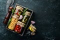 Vegetables and mushrooms in glass jars, food stocks. On a black background. Royalty Free Stock Photo