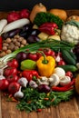 Vegetables and nuts on a brown wooden background