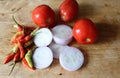 Vegetables, onions, chili peppers, tomato on a wooden board