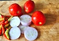 Vegetables, onions, chili peppers, tomato on a wooden board