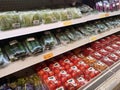 Vegetables packed inside a plastic container and plastic wrap.