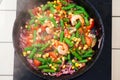 Vegetables in a pan, steam, top, green beans, onions, tomatoes, shrimp Royalty Free Stock Photo