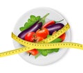 Vegetables on a plate with measuring tape. Dieting concept.