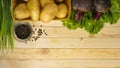 Vegetables potatoes with beets on a wooden table Royalty Free Stock Photo