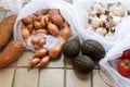 Vegetables in reusable eco friendly mesh bags on bright retro background. Zero waste shopping. Ecological concept. Stop pollution