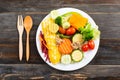 Vegetables salad with wooden spoon and fork Royalty Free Stock Photo