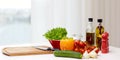 Vegetables, spices and kitchenware on table