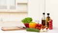 Vegetables, spices and kitchenware on table