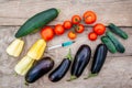 Vegetables and syringe with blue liquid on wooden background. Concept of Non-natural Products, Gmo Royalty Free Stock Photo