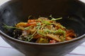 vegetables in teriyaki sauce, macro fragment in plate, side top view