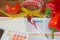 Vegetables, tomato. Measure tape and fresh vegetables in the background. Healthy lifestyle diet with fresh fruits Royalty Free Stock Photo