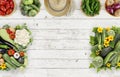 Vegetables top view on kitchen table white wooden