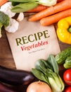 Vegetables on wood background with space for recipe. Organic foo