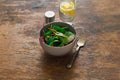 Vegetarian biodynamic food. Bowl salad spinach, beet leaves, water, lemon