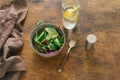 Vegetarian biodynamic food. Bowl salad spinach, beet leaves, water, lemon