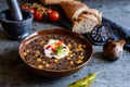 Vegetarian black bean soup with corn, tomatoes and sour cream Royalty Free Stock Photo