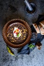Vegetarian black bean soup with corn, tomatoes and sour cream Royalty Free Stock Photo