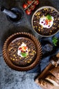 Vegetarian black bean soup with corn, tomatoes and sour cream Royalty Free Stock Photo