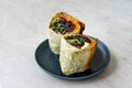 Vegetarian Breakfast Burrito with Wild Rice / Black Rice, Avocado, Kale, Hummus and Carrot Royalty Free Stock Photo