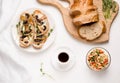 vegetarian breakfast without meat products. on a white table coffee, a salad of bulgur tabule, mushrooms sandwiche