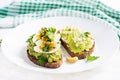 ndwich with avocado puree, boiled eggs and sandwich cream cheese, kiwi, nuts. Royalty Free Stock Photo