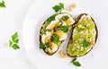 ndwich with avocado puree, boiled eggs and sandwich cream cheese, kiwi, nuts. Royalty Free Stock Photo