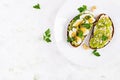 ndwich with avocado puree, boiled eggs and sandwich cream cheese, kiwi, nuts. Royalty Free Stock Photo