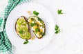 ndwich with avocado puree, boiled eggs and sandwich cream cheese, kiwi, nuts. Royalty Free Stock Photo