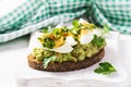 ndwich with avocado puree, boiled eggs and sandwich cream cheese, kiwi, nuts. Royalty Free Stock Photo