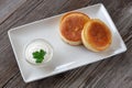 Vegetarian breakfast: thick pancakes with sour cream on a white Royalty Free Stock Photo