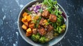 Vegetarian buddha bowl with quinoa, sweet potatoes, tofu, and fresh vegetables Royalty Free Stock Photo