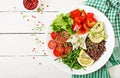 Vegetarian Buddha bowl with quinoa, tofu cheese and fresh vegetables. Royalty Free Stock Photo