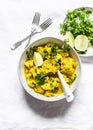 Vegetarian cauliflower curry sauce, cilantro, lime on light background, top view. Delicious indian food Royalty Free Stock Photo