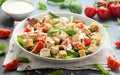 Vegetarian ceasar salad with meat free chicken pieces cherry tomatoes croutons and lettuce in white plate. Royalty Free Stock Photo