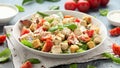 Vegetarian ceasar salad with meat free chicken pieces cherry tomatoes croutons and lettuce in white plate. Royalty Free Stock Photo