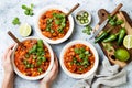 Vegetarian chili con carne with lentils, beans, lime, jalapeno. Mexican traditional dish. Royalty Free Stock Photo