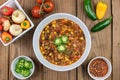 Vegetarian chili flat lay with fresh healthy ingredients