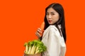Vegetarian concept, Healthy woman holding fresh vegetables consist of lettuce carrot and baby corn