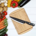 Vegetarian cooking cutting board preparing food with knife and v