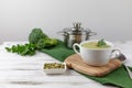 Vegetarian cream of broccoli, potato, onion, garlic, sesame and olive oil, and coconut milk soup. served in a white ceramic plate Royalty Free Stock Photo