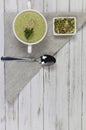 Vegetarian cream of broccoli, potato, onion, garlic, sesame and olive oil, and coconut milk .soup served in a white ceramic plate Royalty Free Stock Photo