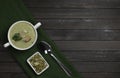 Vegetarian cream of broccoli, potato, onion, garlic, sesame and olive oil, and coconut milk soup. served in a white ceramic plate Royalty Free Stock Photo