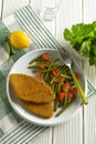 Vegetarian cutlet with green beans and tomato garnish