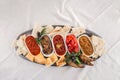 Vegetarian dip Eggplant, baked pepper, zucchini and tomato paste with bread on metal platter Flat lay Royalty Free Stock Photo