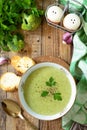 Delicious broccoli cream soup served with garlic croutons on a rustic table. Top view flat lay background. Copy Royalty Free Stock Photo