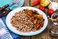 Vegetarian dish. Grain porridge with stewed vegetables