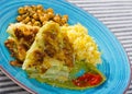 Vegetarian dish of leaves of cabbage in batter with sauces and chickpea